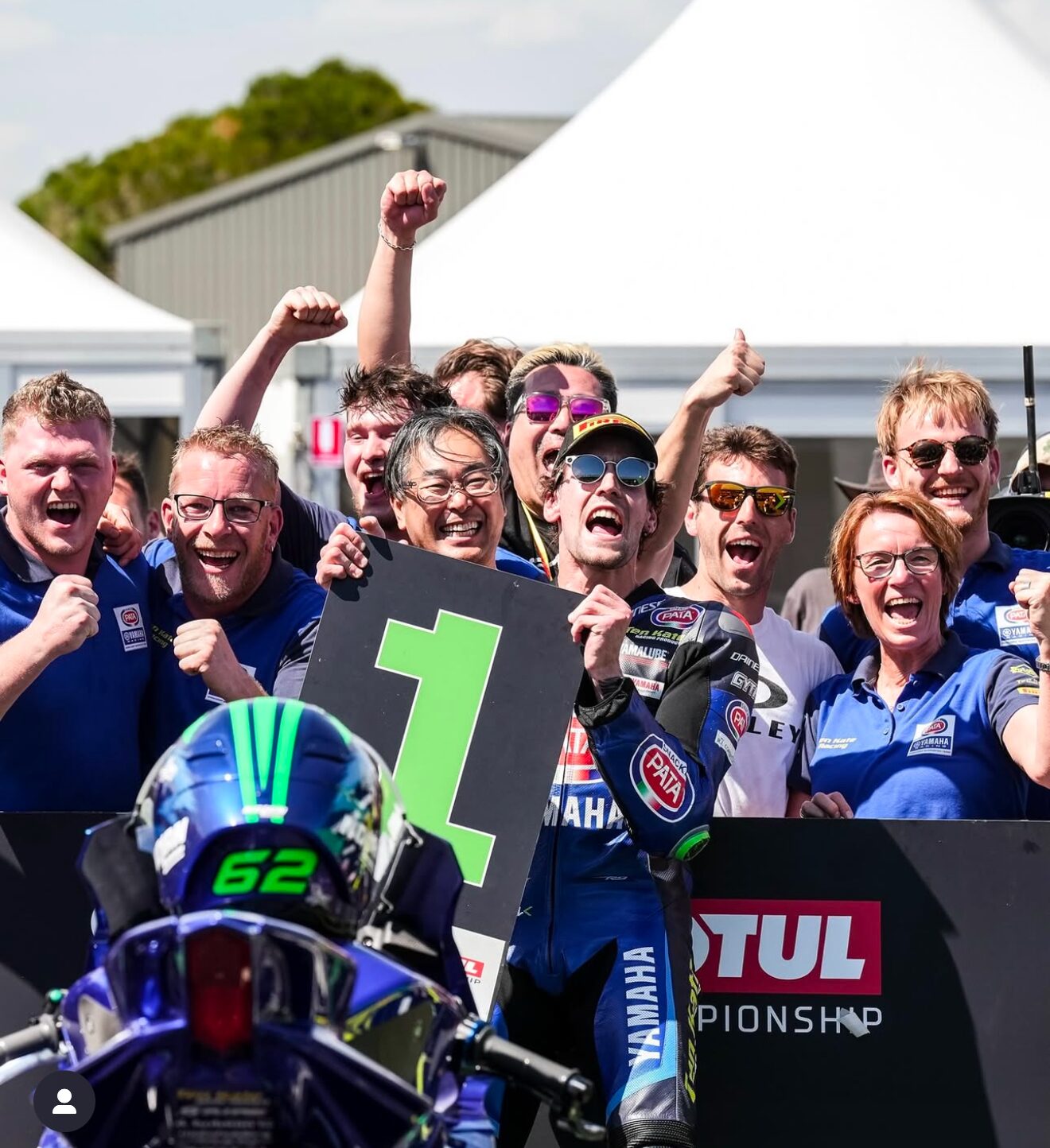 MOTO-TRON supported racing team celebrating a victory